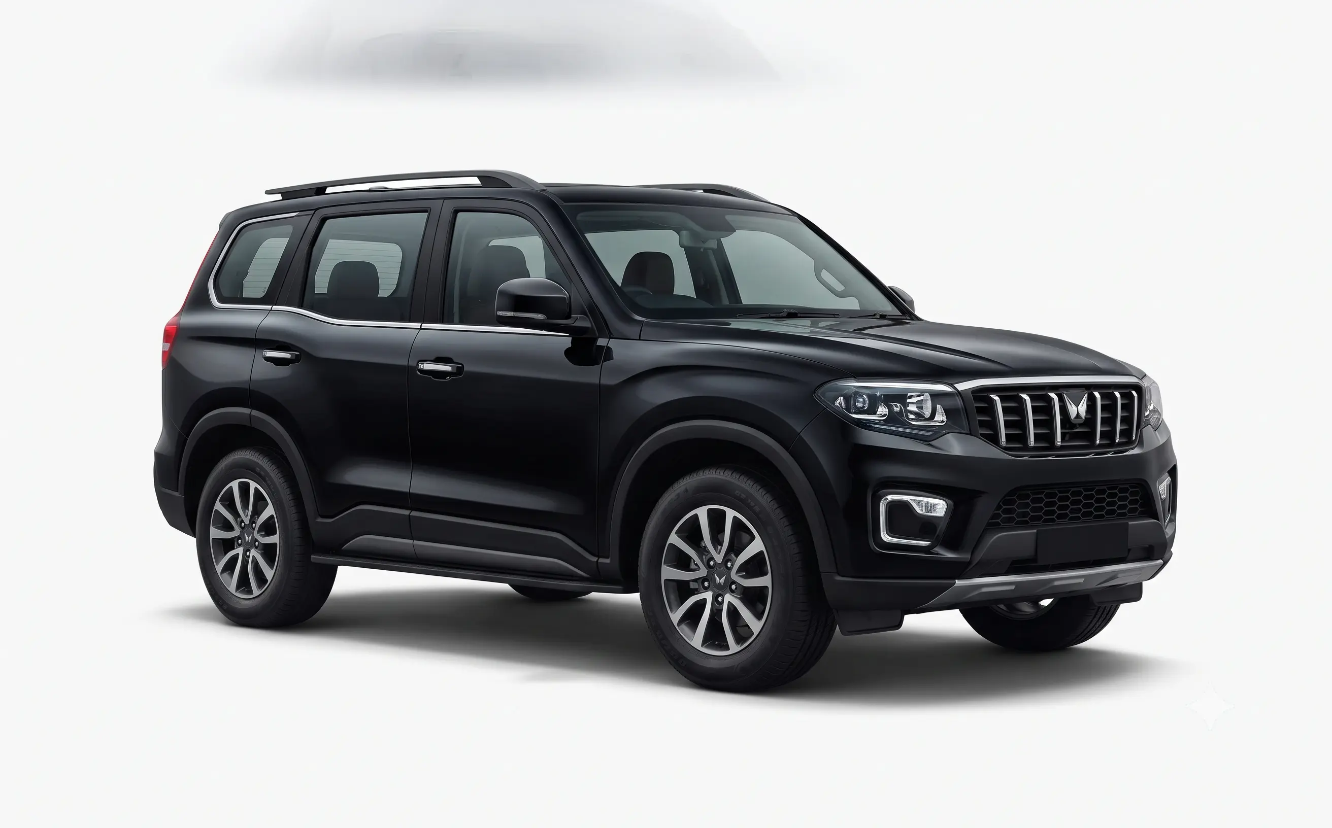 Black 7-seater SUV parked in nature landscape